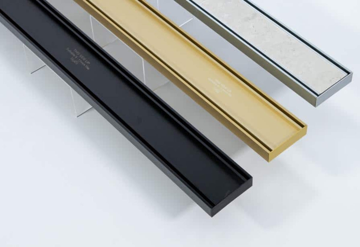 Site-sizable Linear Drain System by Lauxes Grates - Side Outlet Tile Insert Design - Matte Gold